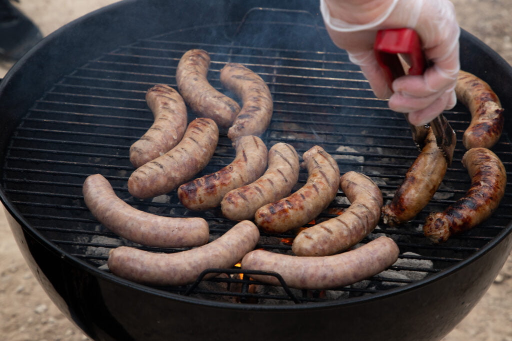 Someone Grilling Sausage