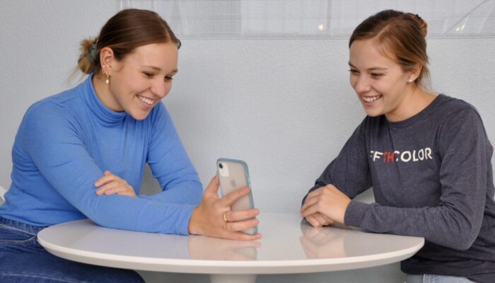 2 Employees sitting at table