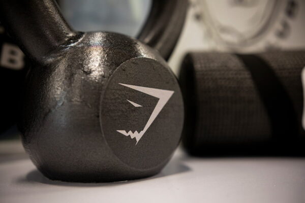 A kettlebell with a Gymshark logo