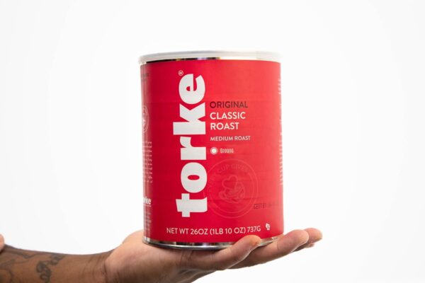 Someone holding Torke container